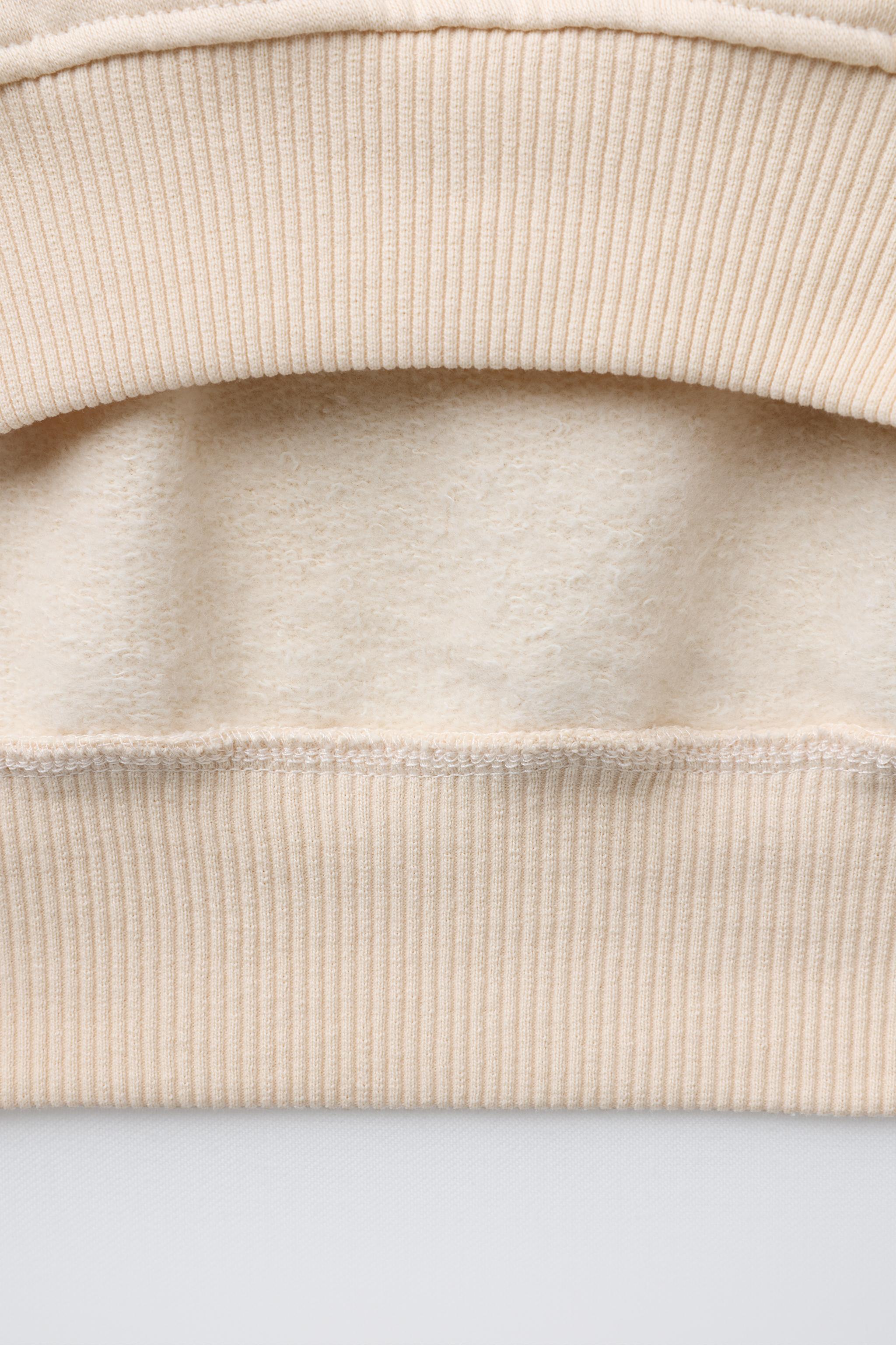 EMBROIDERED DRAWSTRING SWEATSHIRT